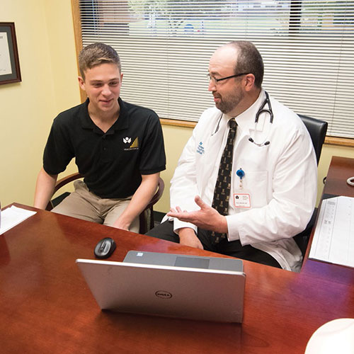 Scott Perkins ’20 collaborated with Dr. Paul Nielsen ’95 (pictured) and Dr. Amy Jolliff, co-medical directors of the Ƶ Community Care Network, and Alex Davis, director, to evaluate the outcomes of the Health Coach program.