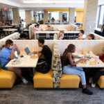 Students eat and socialize in the newly renovated dining area of the Lowry Center at Ƶ.